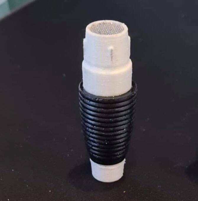 A photo of a 3D printed comlink unit.